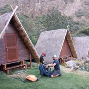 a dad with his son at the andean huts