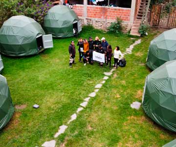panoramic view of tourists with guides in the jungle domes