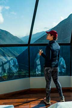 woman viewing the landscape from inside the mountain sky vview
